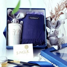 A set of wedding favor for bridesmaid and groomsman with winter scarf, ceramic cup and rabbit gift box gifts